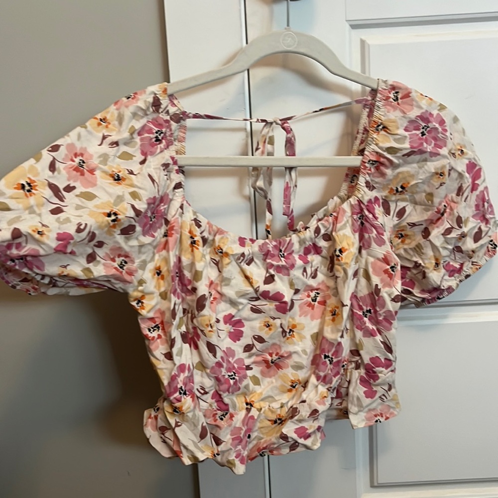 Pink and white floral blouse
